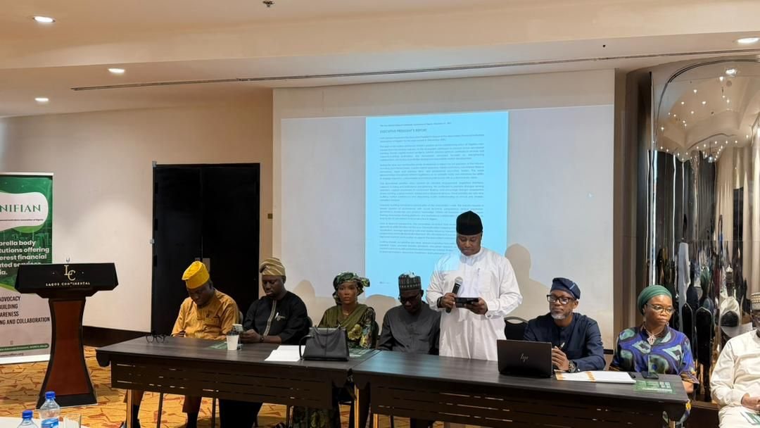The head table at the NIFIAN 2026 AGM, with officers seated before the session screen